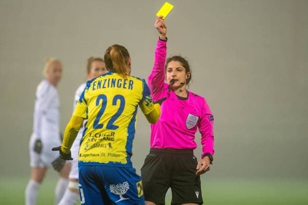 Malmo, Sweden, Mar 3rd 2021: Referee Riem Hussein gives Stefanie Enzinger ( 22 St. Polten) a yellow card during the 1st leg of the round of 16 in UEFA Womens Champions League between FC Rosengard and St Polten at Malmo IP in Malmo, Sweden UEFA WomenÂ s Champions League - FC Rosengard v St Polten 