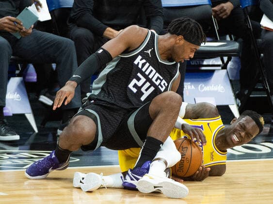 March 3, 2021, Sacramento, CA, USA: Sacramento Kings guard Buddy Hield (24) fouls Los Angeles Lakers guard Dennis Schroder (17) in the first quarter during a game at Golden 1 Center on Wednesday, Mar. 3, 2021 in Sacramento. Sacramento USA - ZUMAj89_ 20210303_zaf_j89_004 Copyright: xPaulxKitagakixJr.x
