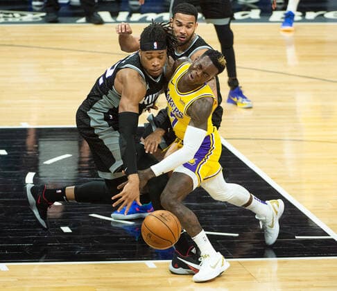 March 3, 2021, Sacramento, CA, USA: Sacramento Kings center Richaun Holmes (22) fouls Los Angeles Lakers guard Dennis Schroder (17) in the second quarter during a game at Golden 1 Center on Wednesday, Mar. 3, 2021 in Sacramento. Sacramento USA - ZUMAj89_ 20210303_zaf_j89_011 Copyright: xPaulxKitagakixJr.x