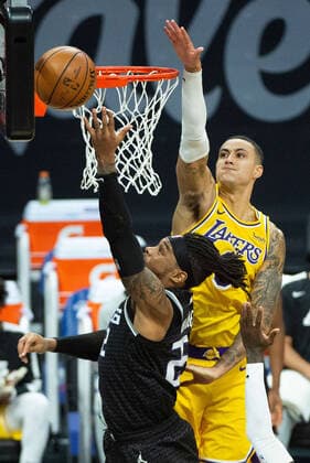 March 3, 2021, Sacramento, CA, USA: Sacramento Kings center Richaun Holmes (22) scores around Los Angeles Lakers forward Kyle Kuzma (0) in the third quarter during a game at Golden 1 Center on Wednesday, Mar. 3, 2021 in Sacramento. Sacramento USA - ZUMAj89_ 20210303_zaf_j89_016 Copyright: xPaulxKitagakixJr.x