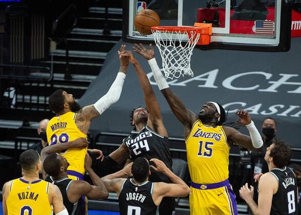 March 3, 2021, Sacramento, CA, USA: Sacramento Kings guard Buddy Hield (24) battles Los Angeles Lakers center Montrezl Harrell (15) and Los Angeles Lakers forward Markieff Morris (88) for rebound with seconds left in the fourth quarter during a game at Golden 1 Center on Wednesday, Mar. 3, 2021 in Sacramento. The Kings win 123-121. Sacramento USA - ZUMAj89_ 20210303_zaf_j89_025 Copyright: xPaulxKitagakixJr.x