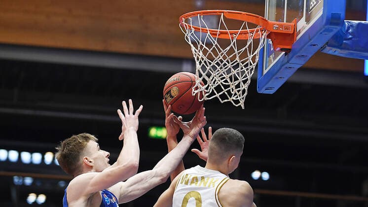 Basketball 1 Bundesliga, season 2020 2021, 22 matchday, Syntainics MBC Weissenfels vs Basketball Löwen Braunschweig 06 02 2021 Duel for the ball at the basket between Philipp Hartwich MBC Weissenfels, back number 12 li and Lukas Wank Guard Braunschweig, back number 100 during the match MBC Weissenfels vs Braunschweig 06 03 2021 Weissenfels Saxony Anhalt Germany Stadthalle Weissenfels