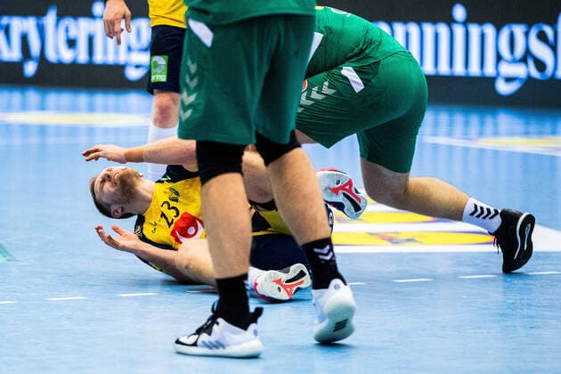 210309 Albin Lagergren of Sweden is in pain during the EHF Euro Qualification match between Sweden and Montenegro on March 9, 2021 in Lund,  Copyright: MATHILDAxAHLBERG BB210309BB300