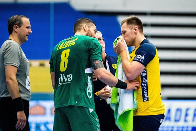 210309 Albin Lagergren of Sweden is in pain during the EHF Euro Qualification match between Sweden and Montenegro on March 9, 2021 in Lund,  Copyright: MATHILDAxAHLBERG BB210309BB301