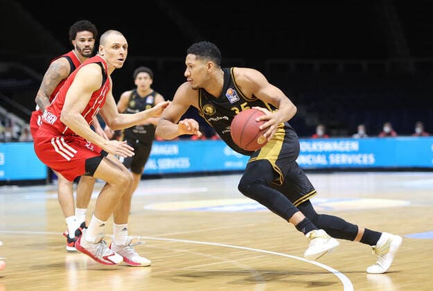 Karim Jallow Basketball Loewen Braunschweig in duel with Robin Amaize FC Bayern Muenchen