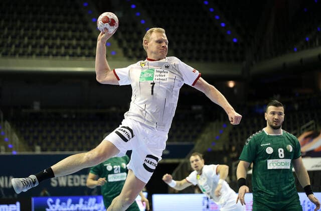 14 03 2021, Handball TOKYO Qualification 2020, Algeria Germany, at Max Schmeling Halle Berlin L R Patrick Wiencek Germany throwing, Aaladine Hadidi Algeria.