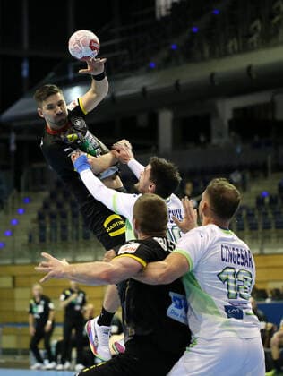 13 03 2021, Handball TOKYO Qualification 2020, Germany Slovenia, at Max Schmeling Halle Berlin L R Fabian Wiede Germany vs Gregor Potocnik Slovenia , Johannes Golla Germany , Darko Cingesar Slovenia