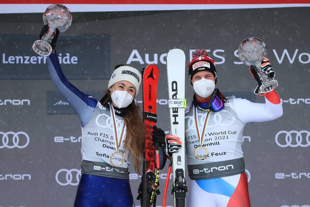 ALPINE SKIING - FIS WC Final Lenzerheide LENZERHEIDE,SWITZERLAND,17.MAR.21- ALPINE SKIING - FIS World Cup Final, award ceremony for the Downhill World Cup, ladies, men. Image shows the rejoicing of Sofia Goggia (ITA) and Beat Feuz (SUI). keywords: crystal globe. GEPAxpictures xMarioxBuehner