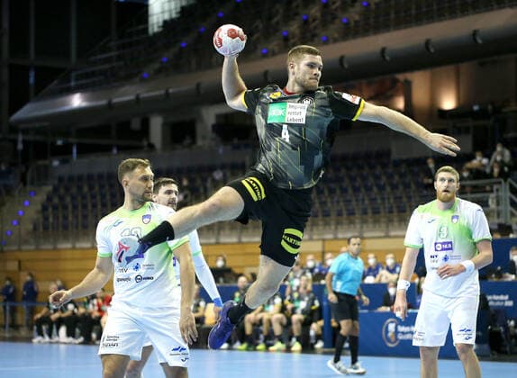 13 03 2021, Handball TOKYO Qualification 2020, Germany Slovenia, in Max Schmeling Halle Berlin L R Darko Cingesar Slovenia , Johannes Golla Germany throwing the ball, Blaz Blagotinsek Slovenia