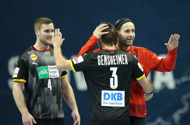 13 03 2021, Handball TOKYO qualification 2020, Germany Slovenia, at Max Schmeling Halle Berlin L R Johannes Golla Germany , Uwe Gensheimer Germany and goalkeeper Silvio Heinevetter Germany cheer