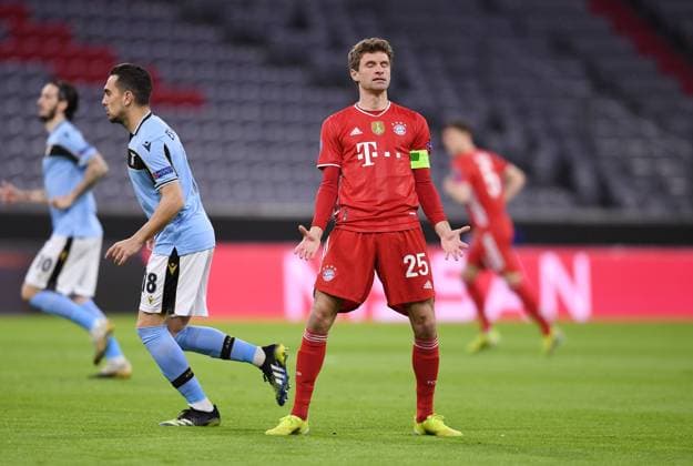 FOOTBALL CHAMPIONS LEAGUE SEASON 2020 2021 Round of 16 Second leg 17 03 2021 FC Bayern Muenchen Lazio Roma Thomas Mueller r, FC Bayern Muenchen and Gonzalo Escalante l, Lazio Roma