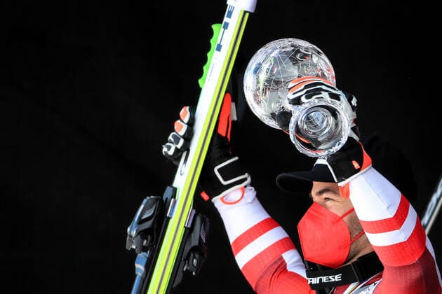 ALPINE SKIING - FIS WC Final Lenzerheide LENZERHEIDE,SWITZERLAND,18.MAR.21- ALPINE SKIING - FIS World Cup Final, award ceremony for the Super G World Cup, men. Image shows the rejoicing of Vincent Kriechmayr (AUT). Keywords: crystal globe, medal. GEPAxpictures xMarioxBuehner