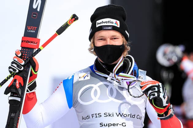 ALPINE SKIING - FIS WC Final Lenzerheide LENZERHEIDE,SWITZERLAND,18.MAR.21- ALPINE SKIING - FIS World Cup Final, award ceremony for the Super G World Cup, men. Image shows the rejoicing of Marco Odermatt (SUI). Keywords: medal. GEPAxpictures xMarioxBuehner