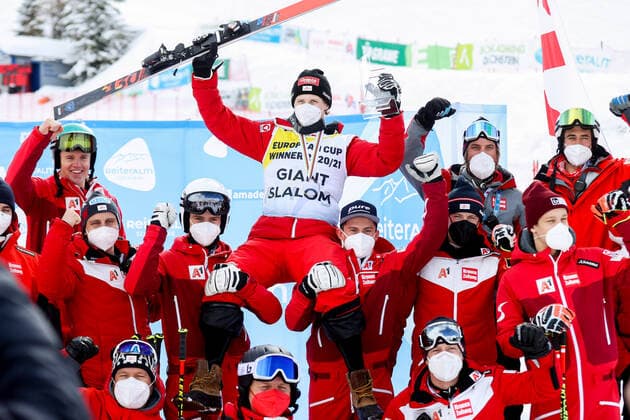 ALPINE SKIING - FIS EC Reiteralm SCHLADMING,AUSTRIA,18.MAR.21- ALPINE SKIING - FIS Europa Cup Final, award ceremony for the Giant Slalom Europa Cup, men. Image shows the rejoicing of Dominik Raschner (AUT) with his team. Keywords: medal, trophy. GEPAxpictures xChristianxWalgram