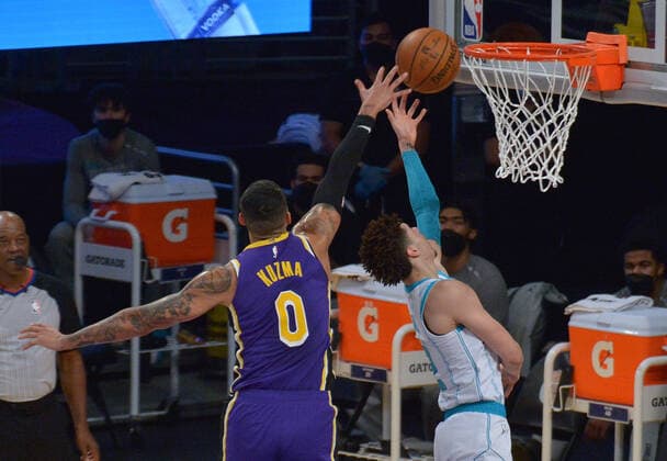 Charlotte Hornets point guard LaMelo Ball scores on Los Angeles Lakers forward Kyle Kuzma during the first half at Staples Center in Los Angeles on Thursday, March 18, 2021. The Lakers defeated the Hornets 116-105.  LAP2021031812