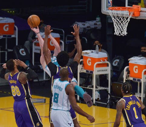 Charlotte Hornets forward Gordon Hayward is fouled by Los Angeles Lakers center Damian Jones during the first half at Staples Center in Los Angeles on Thursday, March 18, 2021. The Lakers defeated the Hornets 116-105.  LAP2021031815