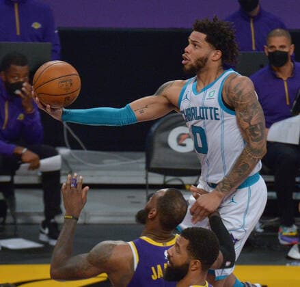 Charlotte Hornets forward Miles Bridges scores over Los Angeles Lakers forward LeBron James during the first half at Staples Center in Los Angeles on Thursday, March 18, 2021. The Lakers defeated the Hornets 116-105.  LAP2021031820 JIMxRUYMEN