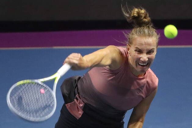 ST PETERSBURG, RUSSIA - MARCH 20, 2021: Russia s Svetlana Kuznetsova returns the ball in a 2021 WTA, Tennis Damen Premier St Petersburg Ladies Trophy semifinal singles match against Russia s Daria Kasatkina at Sibur Arena. Alexander Demianchuk TASS  TS0F9F64
