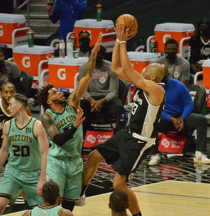 Los Angeles Clippers forward Nicolas Batum scores over Charlotte Hornets forward Miles Bridges during the first half at Staples Center in Los Angeles on Saturday, March 20, 2021. The Clippers defeated the Hornets 125-98.  LAP2021032023 JIMxRUYMEN