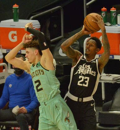 Charlotte Hornets guard LaMelo Ball fouls Los Angeles Clippers guard Lou Williams as he jumps into into him on the three-point line during the first half at Staples Center in Los Angeles on Saturday, March 20, 2021. The Clippers defeated the Hornets 125-98.  LAP2021032024 JIMxRUYMEN