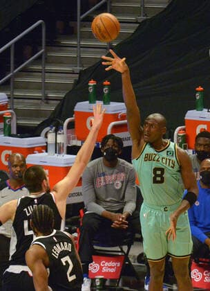Charlotte Hornets center Bismack Biyombo scores a three-pointer over Los Angeles Clippers center Ivica Zubac during the second half at Staples Center in Los Angeles on Saturday, March 20, 2021. The Clippers defeated the Hornets 125-98.  LAP2021032029 LOSxANGELES