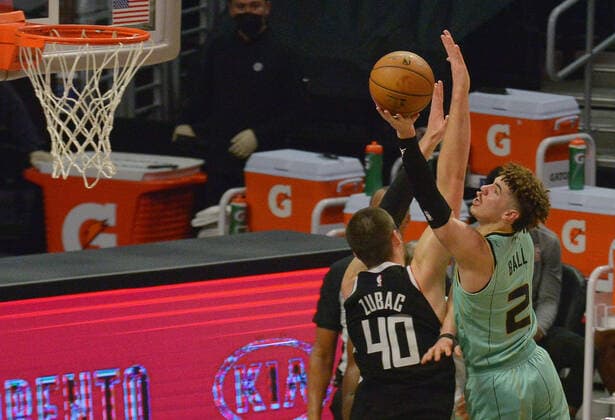 Charlotte Hornets guard LaMelo Ball is fouled by Los Angeles Clippers center Ivica Zubac as he scores during the second half at Staples Center in Los Angeles on Saturday, March 20, 2021. The Clippers defeated the Hornets 125-98.  LAP2021032039 LOSxANGELES
