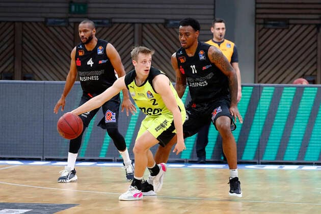 24 Matchday of the easyCredit BBL Basketball Bundesliga on 21 March 2021in the Oberfrankenhalle in Bayreuth Bavaria Germany Season 2020 2021 Medi Bayreuth vs NINERS Chemnitz Nico Wenzl Medi Bayreuth 2 left Isiaha Mike NINERS Chemnitz 11 right