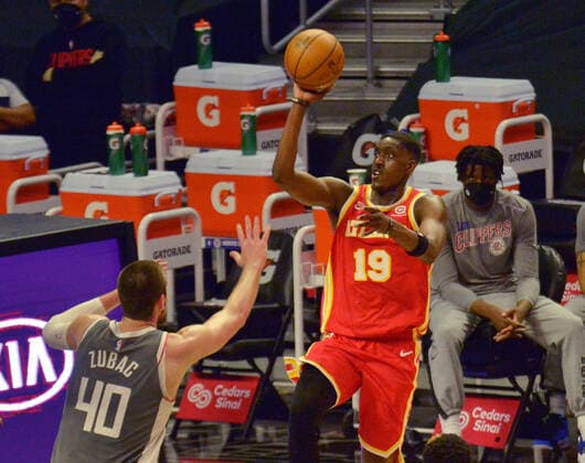Atlanta Hawks forward Tony Snell shoots over Los Angeles Clippers center Ivica Zubac during the first half at Staples Center in Los Angeles on Monday, March 22, 2021. The Clippers defeated the Hawks 119-110 with the comeback victory.  LAP2021032212 JIMxRUYMEN