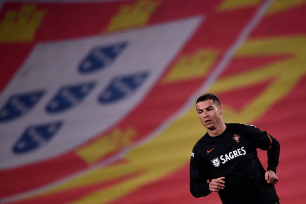 Cristiano Ronaldo of Portugal, with a giant portuguese flag on the background, warms up during the FIFA World Cup, WM, Weltmeisterschaft, Fussball Qatar 2022 qualification football match between Portugal and Azerbaijan at Juventus stadium in Torino (Italy), March, 24, 2021. Photo Federico Tardito Insidefoto insidefoto