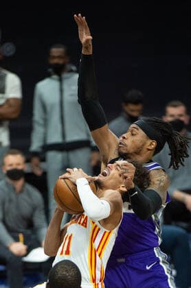 March 24, 2021, Sacramento, CA, USA: Sacramento Kings center Richaun Holmes (22) fouls Atlanta Hawks guard Trae Young (11) in the second quarter during a game at Golden 1 Center on Wednesday, March 24, 2021 in Sacramento. Sacramento USA - ZUMAj89_ 20210324_zaf_j89_009 Copyright: xPaulxKitagakixJr.x