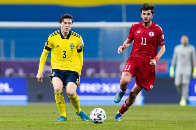 210325 Victor Nilsson Lindelöf of Sweden and Giorgi Kvilitaia of Georgia during the FIFA World Cup Qualifier football match between Sweden and Georgia on March 25, 2021 in Stockholm Photo Andreas L Eriksson BILDBYRAN COP 106 JM0097 bbeng fotboll football soccer fotball vm kval kval fifa world cup qualifier qualifier landskamp sverige sweden sverige a georgia georgien,  Copyright: ANDREASxLxERIKSSON BB210325AE025