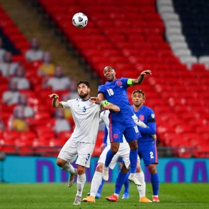 London, England, March 25th 2021: Palazzi Mirko (San Marino 3) and Captain Raheem Sterling (England 10) jump up for a header during the World Cup 2022 Qualification match between England and San Marino at Wembley Stadium in London, England. 2022 World Cup Qualifiers - England V San Marino 