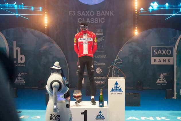 Kasper Asgreen DEN DK Deceuninck Quick Step wins the 64 event of the E3 Prize and can be celebrated on the podium here secluded in the sports hall of Harelbeke without spectators because of the Covid 19 Corona Pandemic Award ceremony Ceremony Ceremony Cheer Joy Luck Emotion Emotion Mimic Gesture Gestic Landscape landscape horizontal Event Event 64 E3 Saxo Bank Classic Harelbeke to Harelbeke 203 9 km Location Location Harelbeke Region West Vlaanderen Flanders Country Belgium Belgium Date Date 26 03 2021 Stiehl Photography