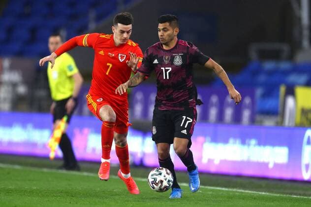 Mandatory Credit: Photo by Kieran McManus BPI Shutterstock (11832375p) Jesus Manuel Corona of Mexico and Tom Lawrence of Wales in action Wales v Mexico, International Friendly, Länderspiel, Nationalmannschaft Football, The Cardiff City Stadium, Cardiff, UK - 27 Mar 2021 EDITORIAL USE ONLY No use with unauthorised audio, video, data, fixture lists, club league logos or live services. Online in-match use limited to 120 images, no video emulation. No use in betting, games or single club league player publications. Wales v Mexico, International Friendly, Football, The Cardiff City Stadium, Cardiff, UK - 27 Mar 2021 EDITORIAL USE ONLY No use with unauthorised audio, video, data, fixture lists, club league logos or live services. Online in-match use limited to 120 images, no video emulation. No use in betting, games or single club league player publications. Copyright: xKieranxMcManus BPI Shutterstockx 11832375p