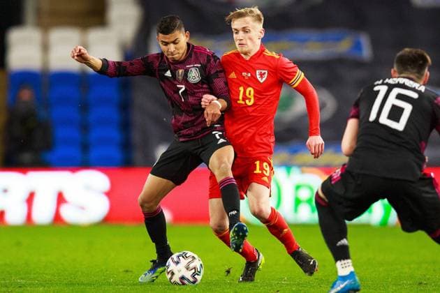 Wales v Mexico Friendly 27 03 2021. International Mexico midfielder Orbelin Pineda (7) and Wales midfielder Matthew Smith (19) during the International Friendly, Länderspiel, Nationalmannschaft match between Wales and Mexico at the Cardiff City Stadium, Cardiff, Wales on 27 March 2021. Cardiff Cardiff City Stadium South Glamorgan Wales Editorial use only , Copyright: xGruffyddxThomasx PSI-12244-0032