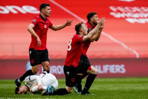 Mandatory Credit: Photo by Nikola Krstic BPI Shutterstock (11832717cn) (L-r) Berat Djimsiti of Albania, Ardian Ismajli of Albania and Keidi Bare of Albania react and Mason Mount of England lays injured Albania v England, FIFA World Cup, WM, Weltmeisterschaft, Fussball Qualifying Group I, Football, Arena Kombetare, Tirana, Albania - 28 Mar 2021 Albania v England, FIFA World Cup Qualifying Group I, Football, Arena Kombetare, Tirana, Albania - 28 Mar 2021  Copyright: xNikolaxKrstic BPI Shutterstockx 11832717cn