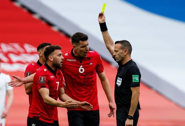 Mandatory Credit: Photo by Nikola Krstic BPI Shutterstock (11832717cc) Keidi Bare of Albania is shown a yellow card from referee Orel Grinfeld Albania v England, FIFA World Cup, WM, Weltmeisterschaft, Fussball Qualifying Group I, Football, Arena Kombetare, Tirana, Albania - 28 Mar 2021 Albania v England, FIFA World Cup Qualifying Group I, Football, Arena Kombetare, Tirana, Albania - 28 Mar 2021  Copyright: xNikolaxKrstic BPI Shutterstockx 11832717cc