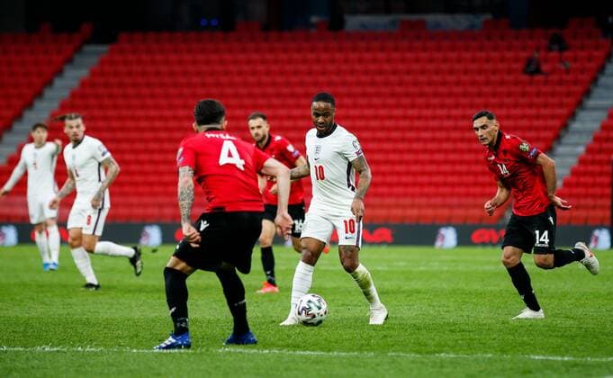 Mandatory Credit: Photo by Nikola Krstic BPI Shutterstock (11832717cq) Raheem Sterling of England with Elseid Hysaj of Albania and Qazim Laci of Albania (right) Albania v England, FIFA World Cup, WM, Weltmeisterschaft, Fussball Qualifying Group I, Football, Arena Kombetare, Tirana, Albania - 28 Mar 2021 Albania v England, FIFA World Cup Qualifying Group I, Football, Arena Kombetare, Tirana, Albania - 28 Mar 2021  Copyright: xNikolaxKrstic BPI Shutterstockx 11832717cq