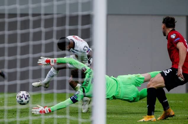 Mandatory Credit: Photo by Nikola Krstic BPI Shutterstock (11832717em) Raheem Sterling of England and Etrit Berisha goalkeeper of Albania Albania v England, FIFA World Cup, WM, Weltmeisterschaft, Fussball Qualifying Group I, Football, Arena Kombetare, Tirana, Albania - 28 Mar 2021 Albania v England, FIFA World Cup Qualifying Group I, Football, Arena Kombetare, Tirana, Albania - 28 Mar 2021  Copyright: xNikolaxKrstic BPI Shutterstockx 11832717em