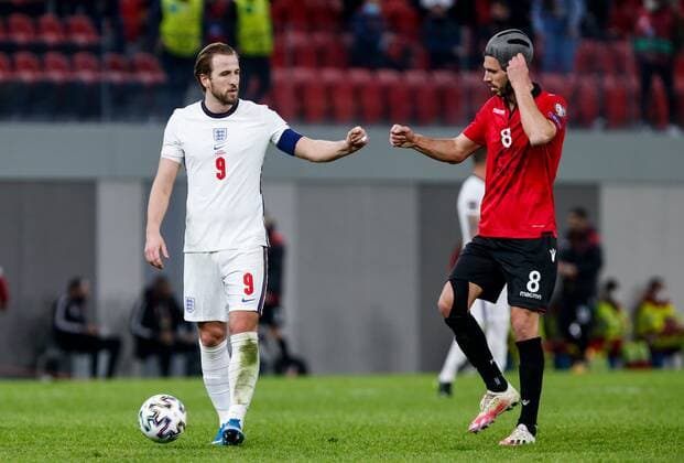 Mandatory Credit: Photo by Nikola Krstic BPI Shutterstock (11832717ek) Harry Kane of England and Klaus Gjasula of Albania at full time Albania v England, FIFA World Cup, WM, Weltmeisterschaft, Fussball Qualifying Group I, Football, Arena Kombetare, Tirana, Albania - 28 Mar 2021 Albania v England, FIFA World Cup Qualifying Group I, Football, Arena Kombetare, Tirana, Albania - 28 Mar 2021 Copyright: xNikolaxKrstic BPI Shutterstockx 11832717ek