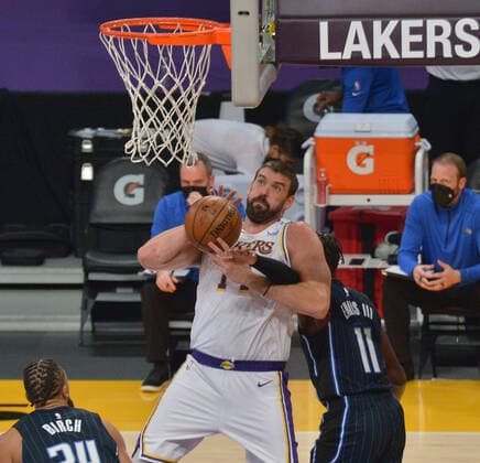 Basketball, NBA, Los Angeles Lakers - Orlando Magic Los Angeles Lakers center Marc Gasol is fouled by Orlando Magic forward James Ennis III during the first half at Staples Center in Los Angeles on Sunday, March 28, 2021. The Lakers defeated the Magic 96-93.  LAP2021032803 JIMxRUYMEN