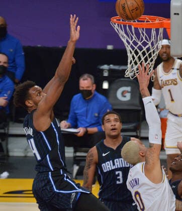 Los Angeles Lakers forward Kyle Kuzma scores on Orlando Magic guard Wendell Carter Jr. during the first half at Staples Center in Los Angeles on Sunday, March 28, 2021. The Lakers defeated the Magic 96-93.  LAP2021032822 JIMxRUYMEN