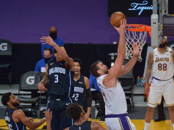 Los Angeles Lakers center Marc Gasol scores on Orlando Magic defenders during the first half at Staples Center in Los Angeles on Sunday, March 28, 2021. The Lakers defeated the Magic 96-93.  LAP2021032823 JIMxRUYMEN