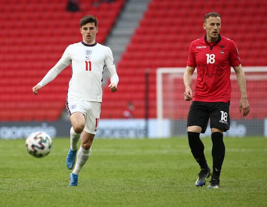 TIRANA, ALBANIA - MARCH 28: 18 Adrian Ismajli of Albania 11 Mason Mount of England during the FIFA World Cup, WM, Weltmeisterschaft, Fussball 2022 Qatar qualifying match between Albania and England at the Qemal Stafa Stadium on March 28, 2021 in Tirana, Albania. Sporting stadiums around Europe remain under strict restrictions due to the Coronavirus Pandemic as Government social distancing laws prohibit fans inside venues resulting in games being played behind closed doors SPO, SOC, FOI 