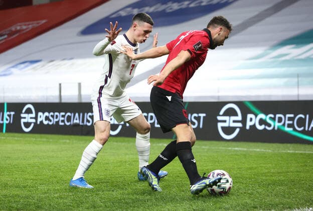 TIRANA, ALBANIA - MARCH 28: Keidi Bare of Albania shields the ball from Phil Foden of England during the FIFA World Cup, WM, Weltmeisterschaft, Fussball 2022 Qatar qualifying match between Albania and England at the Qemal Stafa Stadium on March 28, 2021 in Tirana, Albania. Sporting stadiums around Europe remain under strict restrictions due to the Coronavirus Pandemic as Government social distancing laws prohibit fans inside venues resulting in games being played behind closed doors SPO, SOC, FOI 
