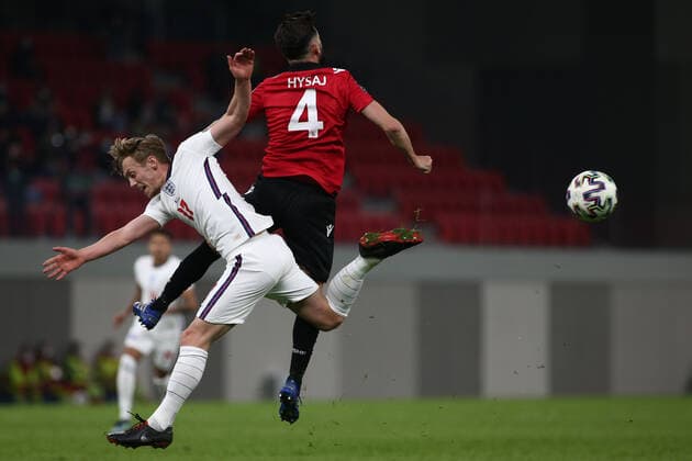 TIRANA, ALBANIA - MARCH 28: James Ward-Prowse of England and Elseid Hysaj of Albania contest a header during the FIFA World Cup, WM, Weltmeisterschaft, Fussball 2022 Qatar qualifying match between Albania and England at the Qemal Stafa Stadium on March 28, 2021 in Tirana, Albania. Sporting stadiums around Europe remain under strict restrictions due to the Coronavirus Pandemic as Government social distancing laws prohibit fans inside venues resulting in games being played behind closed doors SPO, SOC, FOI 