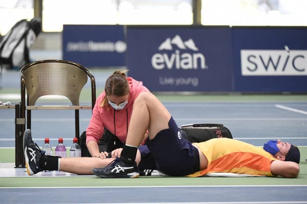 31 03 2021, Biel, Swiss Tennis Arena, ITF WORLD TENNIS TOUR M25 BIEL Leandro Riedi Switzerland vs Dominic Stricker Switzerland , Dominic Stricker gets treatment on the court Biel Bern Switzerland  Copyright: xJustPictures.ch ManuelxWinterbergerx