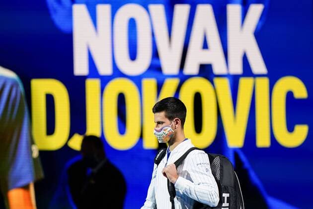 Mandatory Credit: Photo by Dave Shopland BPI Shutterstock (11013812f) Novak Djokovic of Serbia wears a mask as he walks out on to court for a group round match Nitto ATP, Tennis Herren Finals 2020, Day Two, Tennis, The 02 Arena, London, UK - 16 Nov 2020 EDITORIAL USE ONLY No use with unauthorised audio, video, data, fixture lists, club league logos or live services. Online in-match use limited to 120 images, no video emulation. No use in betting, games or single club league player publications. Nitto ATP Finals 2020, Day Two, Tennis, The 02 Arena, London, UK - 16 Nov 2020 EDITORIAL USE ONLY No use with unauthorised audio, video, data, fixture lists, club league logos or live services. Online in-match use limited to 120 images, no video emulation. No use in betting, games or single club league player publications.  Copyright: xDavexShopland BPI Shutterstockx 11013812f