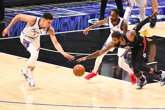 LOS ANGELES, CA - APRIL 01: Denver Nuggets Forward Michael Porter Jr. (1) and Los Angeles Clippers Guard Paul George (13) battle for a loose ball during a NBA, Basketball Herren, USA game between the Denver Nuggets and the Los Angeles Clippers on April 1, 2021 at STAPLES Center in Los Angeles, CA. The game was played without fans due to the COVID-19 pandemic. (Photo by Brian Rothmuller Icon Sportswire) NBA: APR 01 Nuggets at Clippers Icon210401004