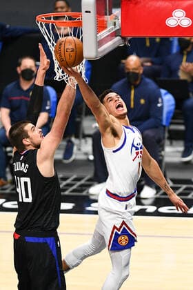 LOS ANGELES, CA - APRIL 01: Denver Nuggets Forward Michael Porter Jr. (1) goes up for a shot under pressure from Los Angeles Clippers Center Ivica Zubac (40) during a NBA, Basketball Herren, USA game between the Denver Nuggets and the Los Angeles Clippers on April 1, 2021 at STAPLES Center in Los Angeles, CA. The game was played without fans due to the COVID-19 pandemic. (Photo by Brian Rothmuller Icon Sportswire) NBA: APR 01 Nuggets at Clippers Icon210401011
